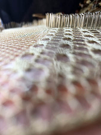 close up of bobbin lace stitches