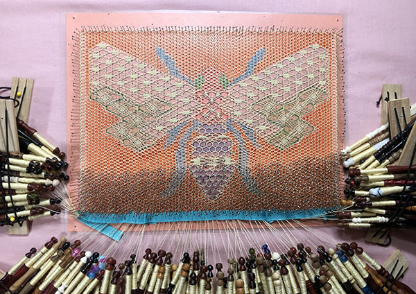 Bobbin lace bee pattern nearly complete