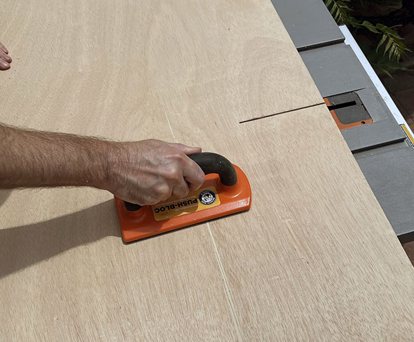 Cutting the wood on a table saw