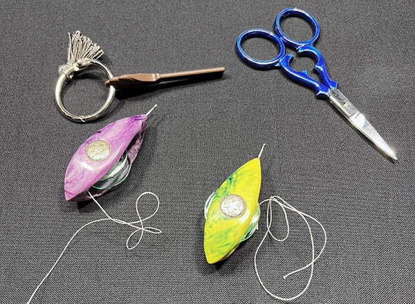 Shuttle Brothers GR-8 tatting shuttles, a picot gauge, and scissors