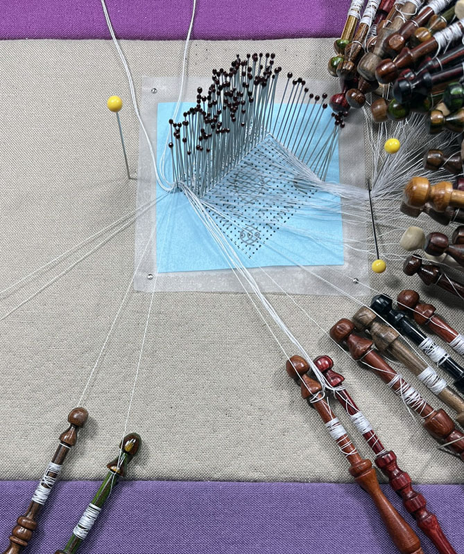 I started by adding all of the bobbins to the outer row of the diamond. 