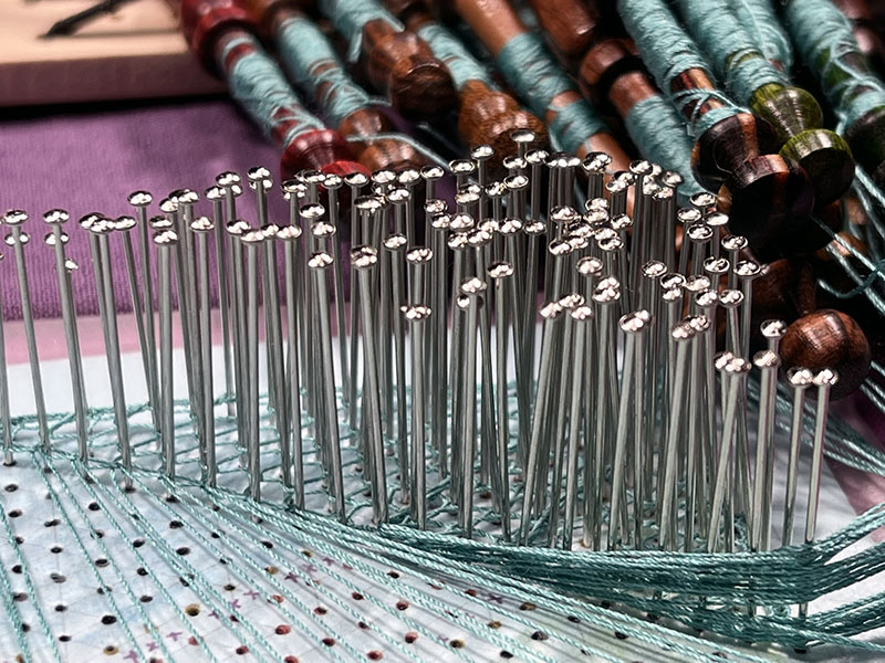 Lots of pins, but look beyond to the thread. 